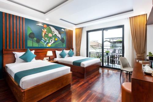 Postel nebo postele na pokoji v ubytování Le Vert Angkor Hotel