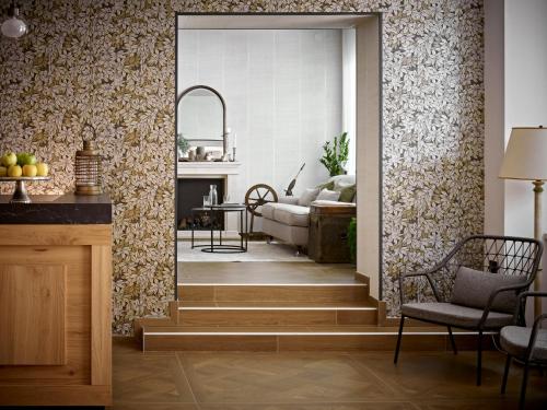 a living room with a stairway leading to a living room at Hotel America in Trento