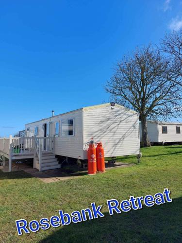 an rv parked next to two fire hydrants at Rose bank Retreat in Hunmanby