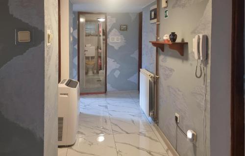 a hallway with a tile floor and a walk in shower at Amazing Home In Velika Mlaka With Wifi in Velika Mlaka