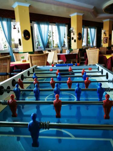 a group of people playing a game of billiard at Hotel Napoleon in Lido di Jesolo