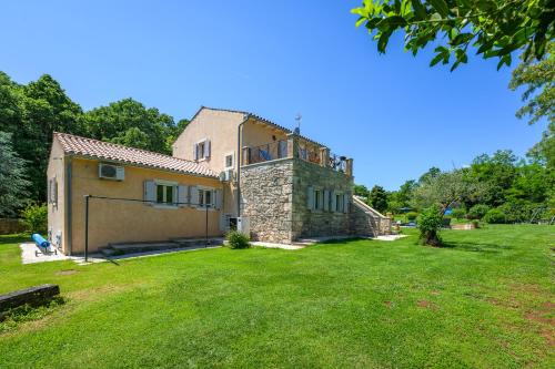 an exterior view of a house with a yard at Villa Lipa in Krnica