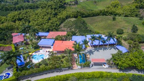 an aerial view of a house with a swimming pool at Finca Hotel la Manuela in Armenia