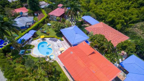 an overhead view of a house with blue roofs at Finca Hotel la Manuela in Armenia