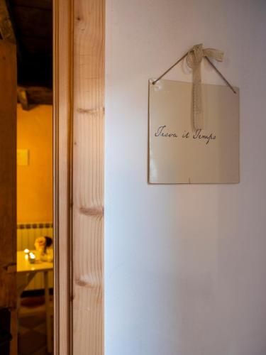 a picture on a wall with a sign that reads home is unique at Al Castello Resort in Sillavengo