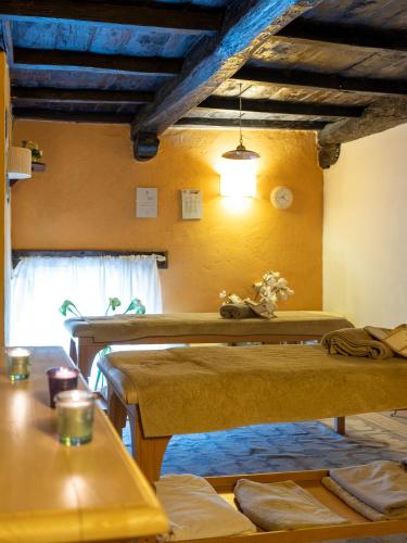a room with two beds and a window at Al Castello Resort in Sillavengo