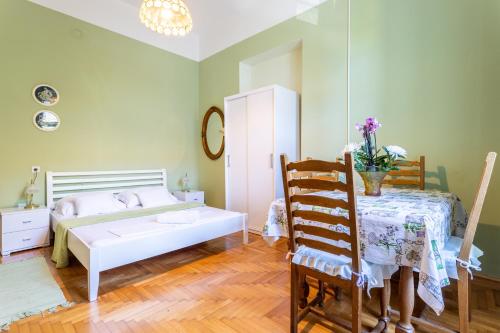 A bed or beds in a room at Traditional Dalmatian apt 3 min walk to beach