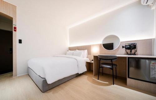 Postel nebo postele na pokoji v ubytování Hotel Yam Sangmu