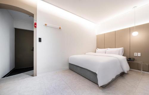 Postel nebo postele na pokoji v ubytování Hotel Yam Sangmu