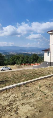 a car parked on a road next to a building at Akkayalar Aerie House in Çepni