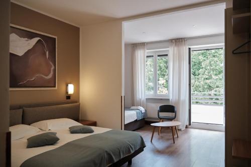Postel nebo postele na pokoji v ubytování Albergo San Carlo