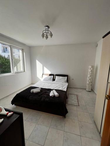 a bedroom with a bed with two towels on it at Holiday home in Kranevo in Kranevo