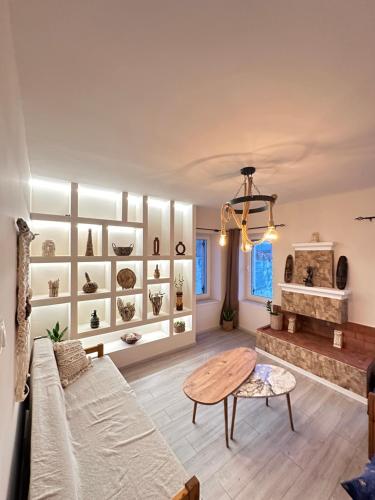 a living room with a couch and a table at Asteris luxury house in Polygryos