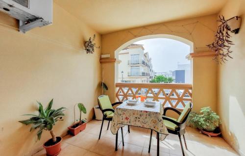 a balcony with a table and chairs on a balcony at 2 Bedroom Stunning Apartment In Nerja in Nerja