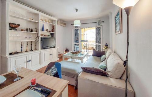 a living room with a couch and a table at 2 Bedroom Stunning Apartment In Nerja in Nerja