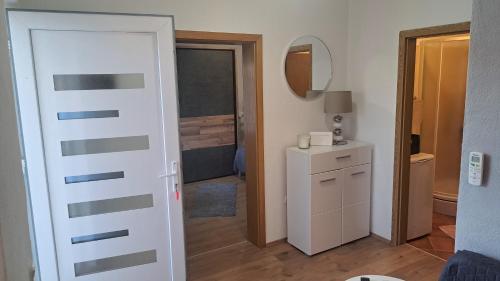 a room with a door leading to a bathroom at Stone House Josipa in Ražanj