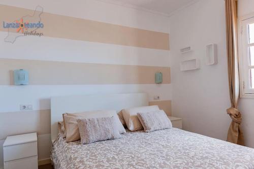 Postel nebo postele na pokoji v ubytování Casita Luna VV Playa Bastian