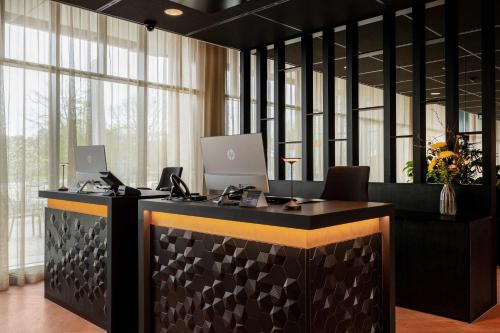 an office with two computers on a desk at U Parkhotel in Enschede