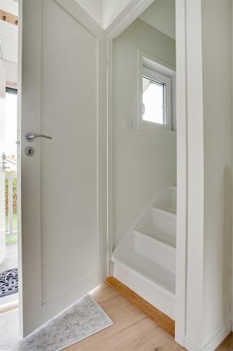a bathroom with a glass door leading to a shower at Villa med 4 rum i Stråssa in Lindesberg