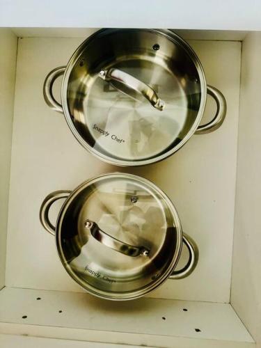 two metal pots on a wall in a microwave at Private Studio in Cape Town, Near Canal Walk & Table Mountain in Cape Town