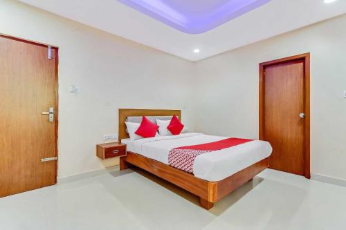 Postel nebo postele na pokoji v ubytování Collection O Champion Paradise