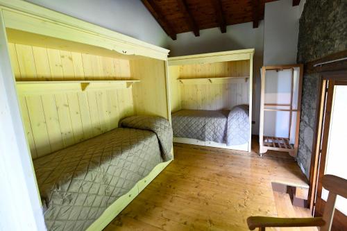 Ένα ή περισσότερα κρεβάτια σε δωμάτιο στο Villa Borgo Murs