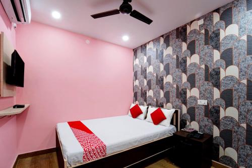 Postel nebo postele na pokoji v ubytování Hotel O Jai Jagannath Inn