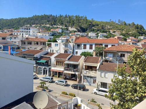 a view of a town with cars parked in a parking lot at Ulpiana - Apartments,Rooms,Hostel in Ulcinj