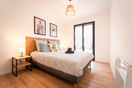 a bedroom with a bed with a teddy bear on it at Le Cool'Nest - Proche Disney et Val d'Europe 10mn in Esbly