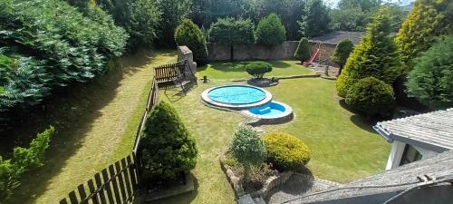an overhead view of a backyard with a swimming pool at U Boží hory. in Žulová