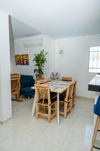 a dining room with a table and chairs at Casa Campo Mi Valle Km9 in Valledupar