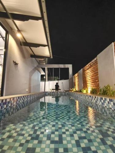 Πισίνα στο ή κοντά στο D'Pasir Lodge