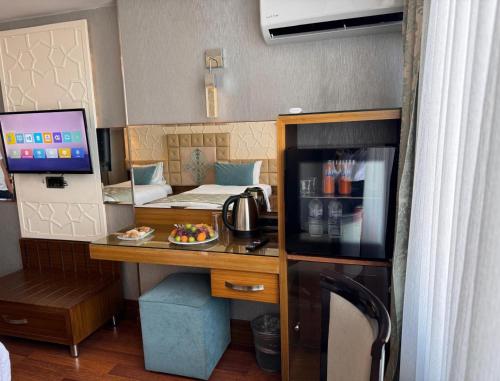a small room with a desk and a bed at Grand Star Hotel Premium in Istanbul