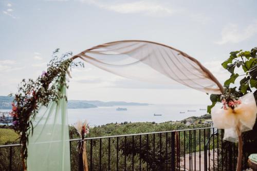 a wedding ceremony with a view of the ocean at Villa ELM in Ankaran