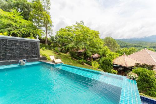 an image of a swimming pool at a villa at Guru Resort Chiang Mai in Ban Muang Ha