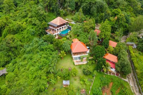 an aerial view of a house in the forest at Guru Resort Chiang Mai in Ban Muang Ha
