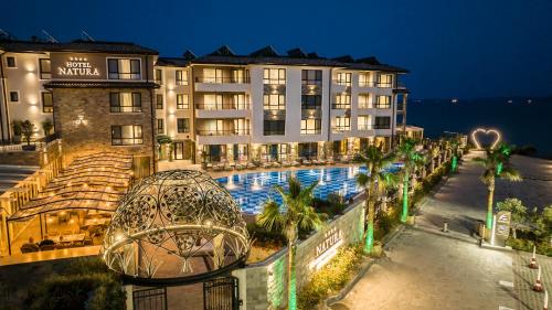 a view of a hotel with a swimming pool at Natura All Seasons Boutique Hotel in Burgas City