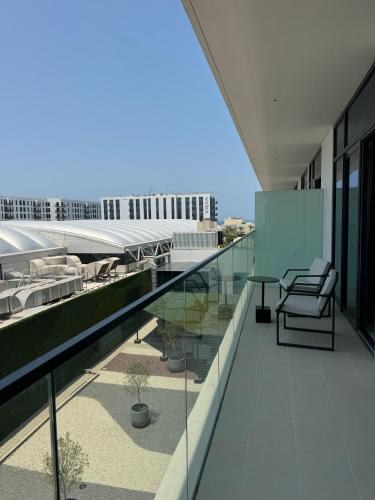a balcony with a view of a building at Address Beach Resort Residence Bahrain in Rayyā