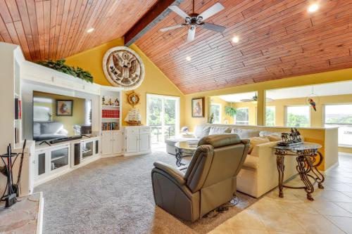 a living room with a couch and a table at Lake-View Osage Beach Resort Home with Game Room! in Osage Beach