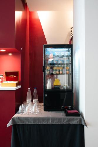 an open refrigerator on top of a table at Hotel Parnaso in Trebisacce