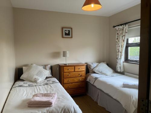Postel nebo postele na pokoji v ubytování Spiddal Cottage