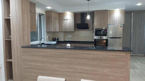 a large kitchen with a large island in a room at Leila in Kelibia