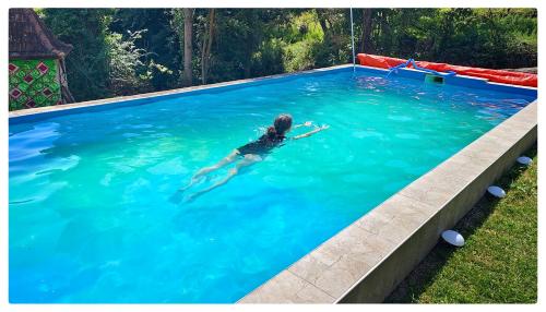 a person swimming in a large swimming pool at Zvezdano nebo in Svrljig