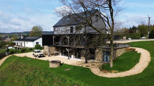 an aerial view of a large stone house with a yard at Lu T Chene in Opont