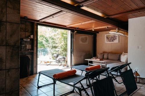 a room with chairs and a bed and a couch at Big quiet Villa with garden and pool in Vienna