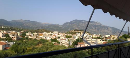 a view of a city from a balcony at Victoria's house in Kalamata