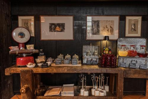 a wooden table with various items on top of it at Al Castello Resort in Sillavengo
