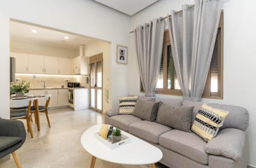 a living room with a couch and a table at St John Residence in Chania