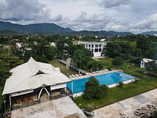 an aerial view of a resort with a swimming pool at Vangvieng Lina hotel in Vang Vieng