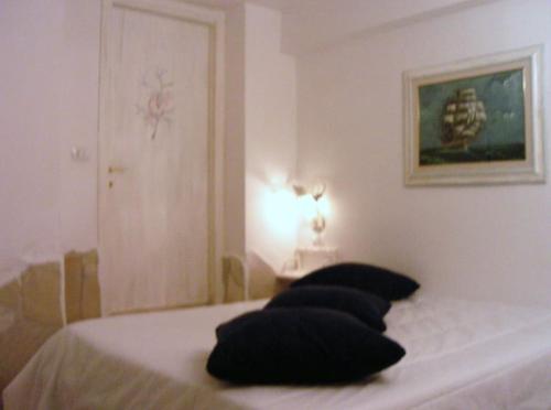 Giường trong phòng chung tại Dimora Il Porto segreto